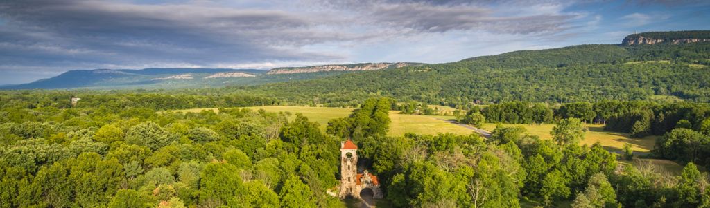 The Testimonial Gateway Tower in the foreground with the length of the ridge in the background