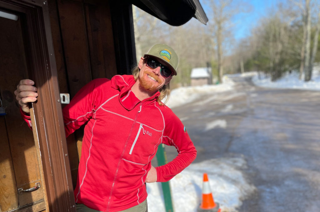 Trailhead Ranger greets visitors at a trailhead booth