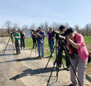Peregrine Watch volunteers look through telescopes at Mohonk Preserve