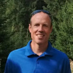 Christopher Zimmerman in front of trees