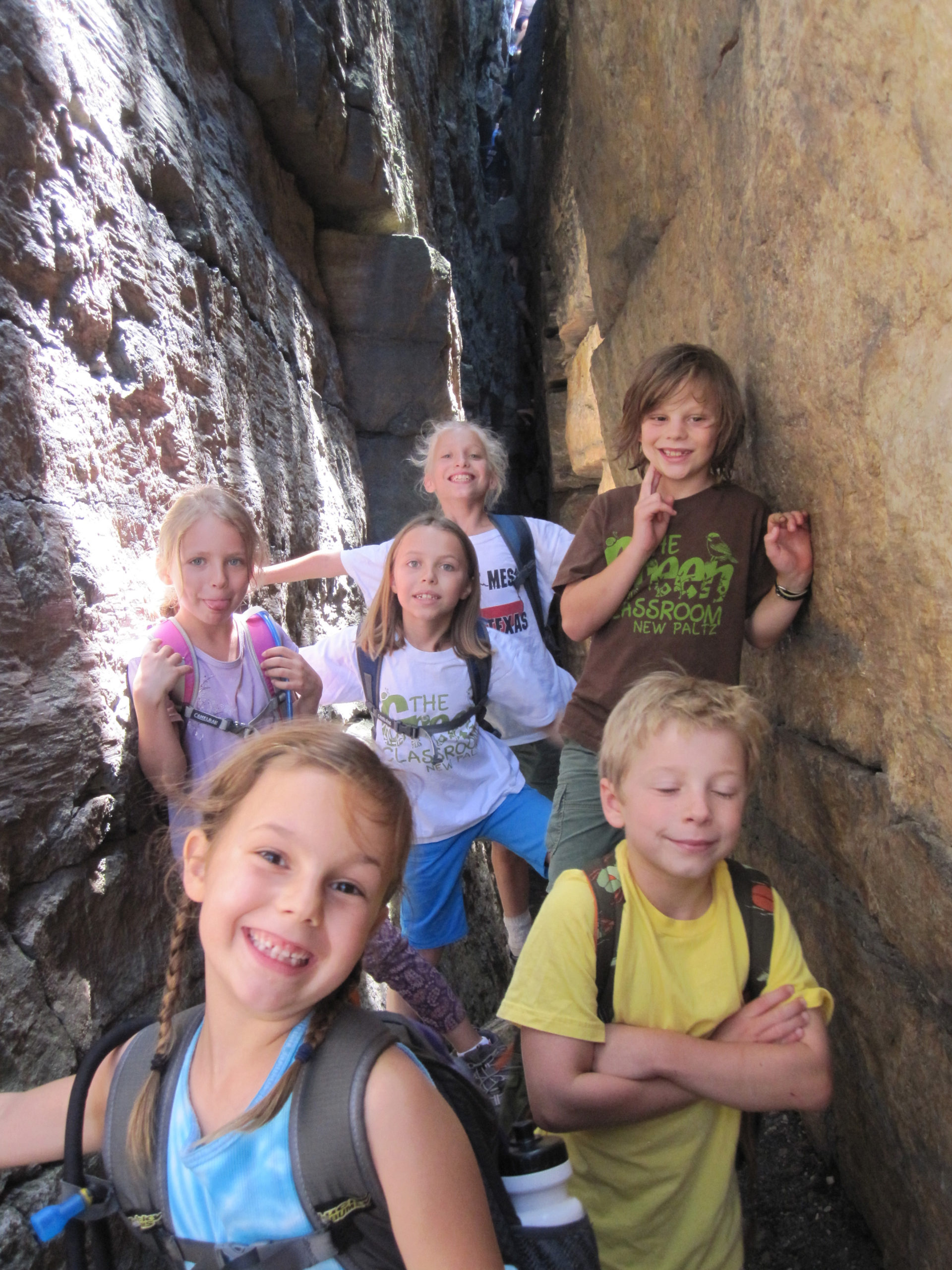 Children on a hike smiling