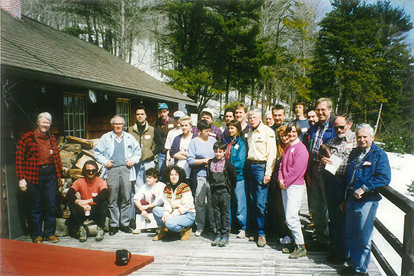 A group of volunteers stand together outside the Preserve Visitor Center