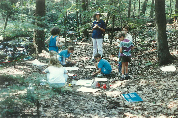 Outdoor activity session with young Naturalists in a forest setting