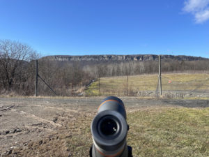 Jan.23 Binocular scope pointed at the Gunks on a blue sky winter's day