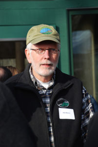 A man wearing a mohonk preserve hat is photographed outside the visitor center