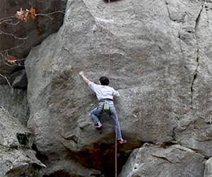 Rock climber bouldering